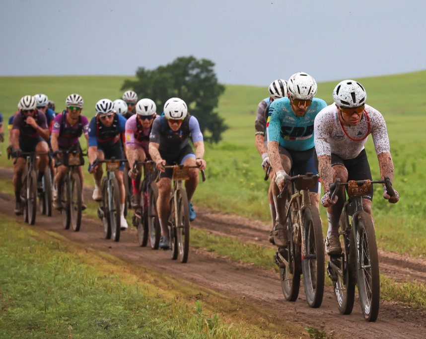 Lead group of muddy Unbound 200 riders in the Flint Hills